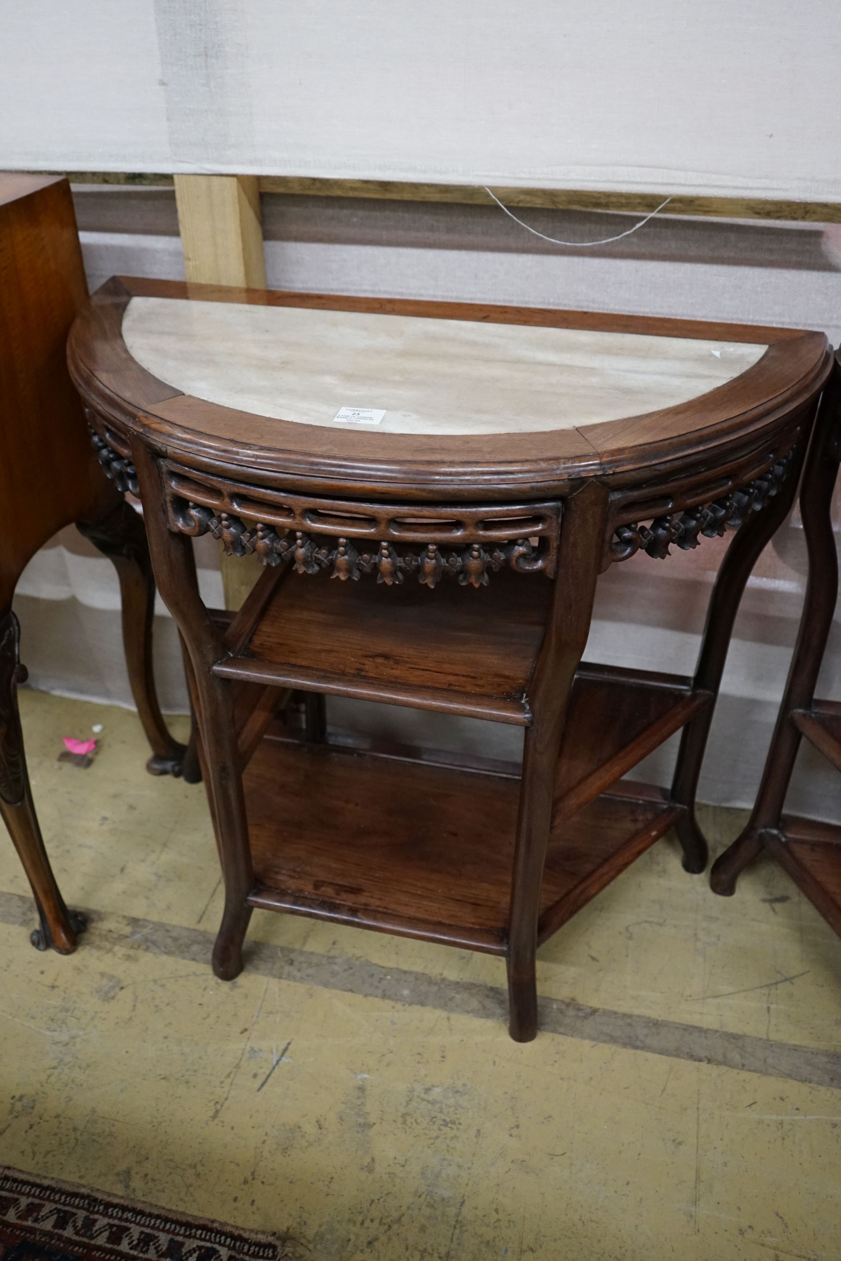 A pair of Chinese marble-topped demi lune console tables, width 82cm, depth 40cm, height 80cm